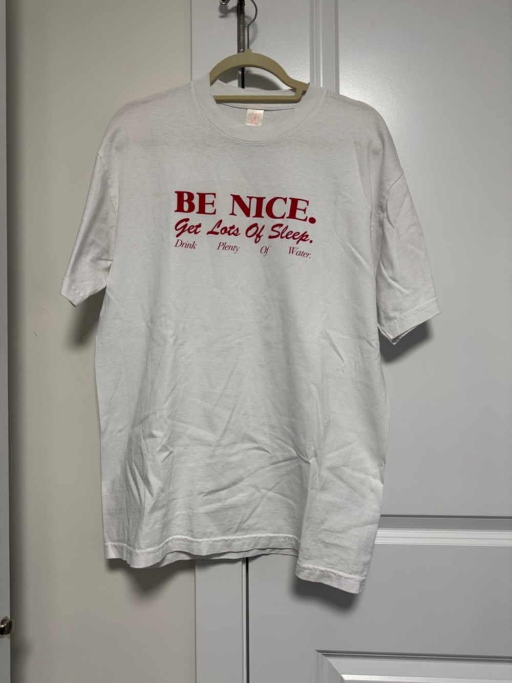 Sporty and Rich White Graphic Tee - 'Be Nice' Red Print